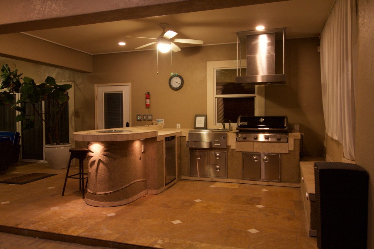 A kitchen with an island and stove in it