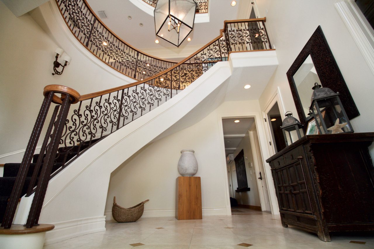 A large staircase with a metal railing.