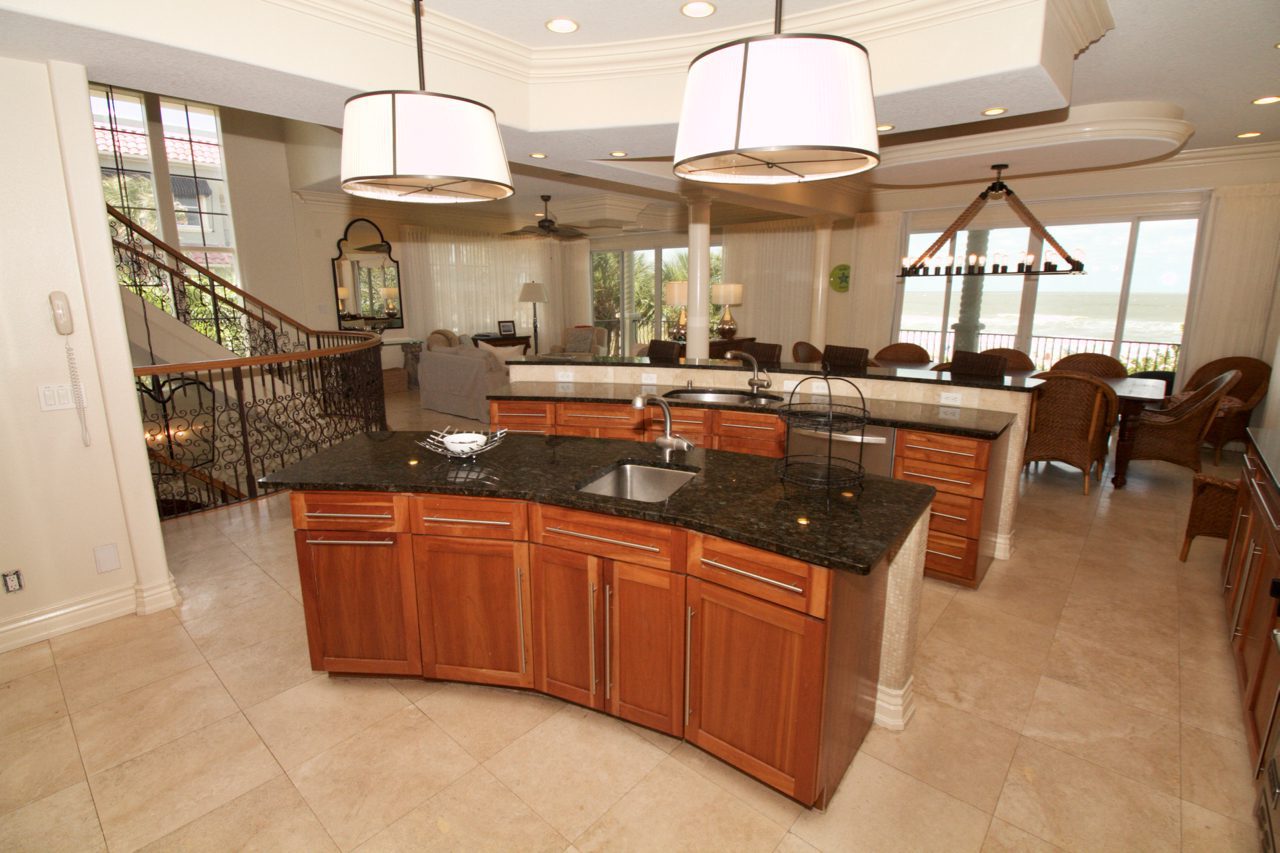 A kitchen with two sinks and a large island.